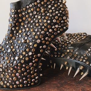 100% leather, hand made shoes with metal details.